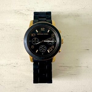 Black and gold Michael Kors women’s watch
